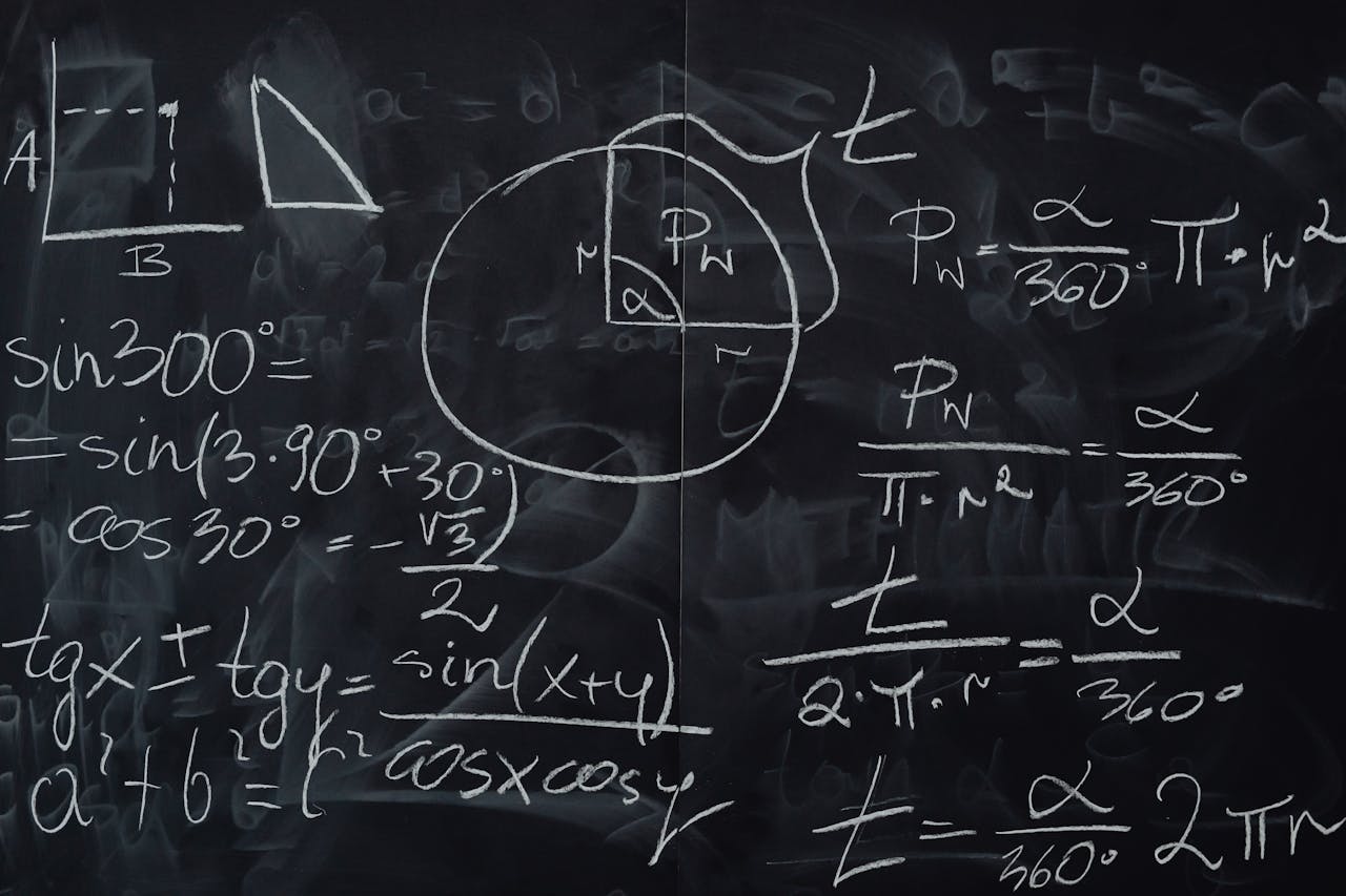 Complex trigonometric equations and geometric diagrams drawn on a classroom blackboard.